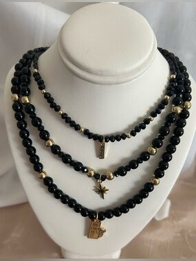 Black and Gold Multi-Strand Necklace with Layered Design